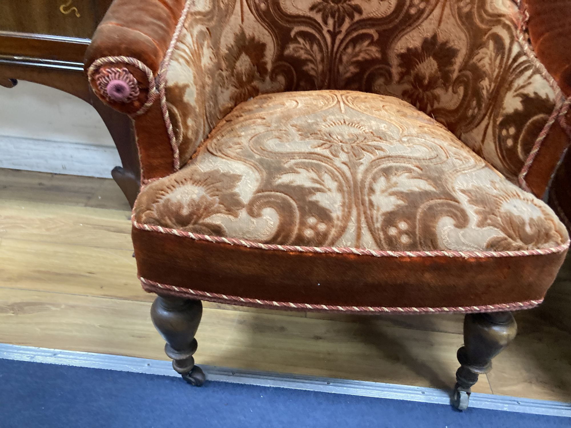 A small Victorian chaise longue, length 120cm, depth 80cm, height 84cm and matching tub framed armchair, each with cut red velvet uphol